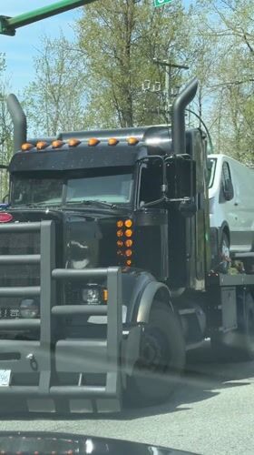 Semi-truck stops at traffic light in Burnaby