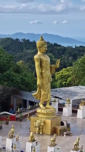 Temple visit and donation captured at Ko Samui Buddhist site