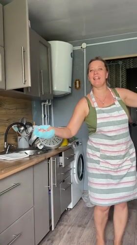 Barefoot, aproned, and singing in a Russian kitchen