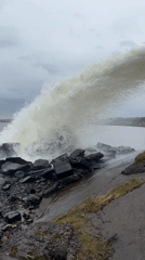 Water discharge observed striking rocks near Noviy, Russia