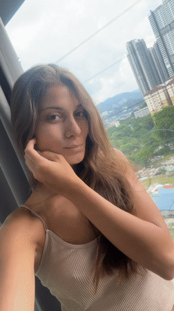Woman photographed at Kuala Lumpur high-rise during early morning hours