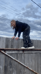 Backyard gathering with fence climbing and grilling in Chaikovsky