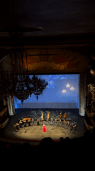 Female singer performs in red dress at Khimki theater