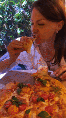 Woman dines on egg-topped flatbread in Saint Petersburg restaurant