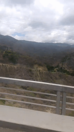 Vehicle journey through mountainous Caracas landscape recorded on video