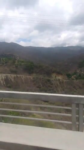 Vehicle journey through mountainous Caracas landscape recorded on video