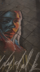Colorful chalk portraits spotted on Berlin sidewalk