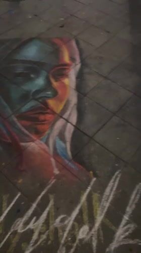 Colorful chalk portraits spotted on Berlin sidewalk