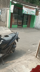 Morning street life across a busy West Jakarta neighborhood