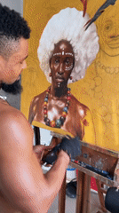 Artist paints portrait in studio workspace in Ado, Nigeria