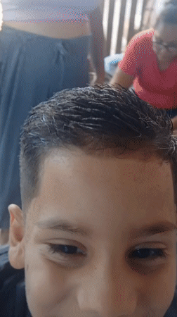 Child gets decorative fade haircut in Porlamar, Venezuela