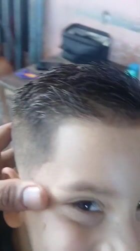 Child gets decorative fade haircut in Porlamar, Venezuela