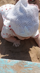 Children play in sandbox during morning in Noviy, Russia