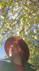 Woman poses among spring blossoms in Yekaterinburg park