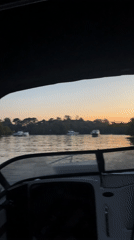 Boats navigate busy waterways near Victoria, Argentina at dusk