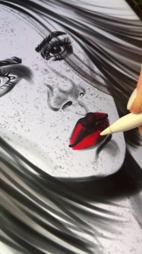 Grayscale digital portrait with red lips takes shape on tablet