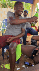 Men gather for casual afternoon drinks in Kurunduma, Nigeria