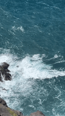 Tourists photograph ocean views from Spanish clifftop observation platforms