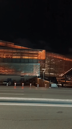 Woman records nighttime selfies in downtown Baku
