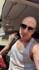 Tattooed man exits car in Pleven, Bulgaria