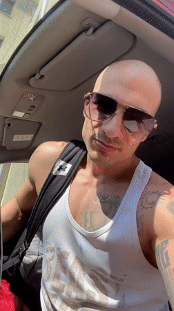 Tattooed man exits car in Pleven, Bulgaria