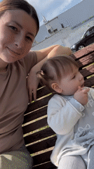 Moscow family enjoys quiet park morning with toddler, pigeons