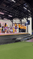 Children perform traditional dances on outdoor stage in El Tirano