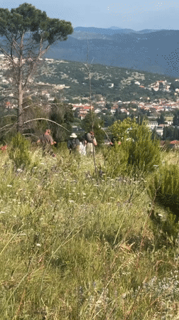 Film crew works outdoors as plane flies over Podgorica
