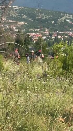 Film crew works outdoors as plane flies over Podgorica