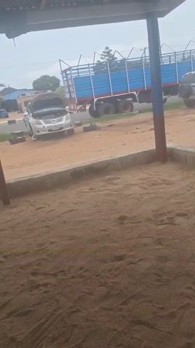 Text graphics and roadside car work in Jalingo, Nigeria