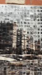 Person visits portrait memorial wall in Barcelona