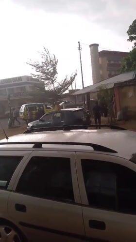 Heavy downpour reduces visibility in Dadi Riba street scene