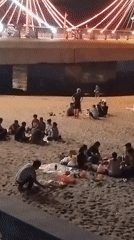Beach gatherings and statue interactions documented in Nha Trang