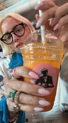 Orange drink and a standout teddy bear jacket at Gardermoen