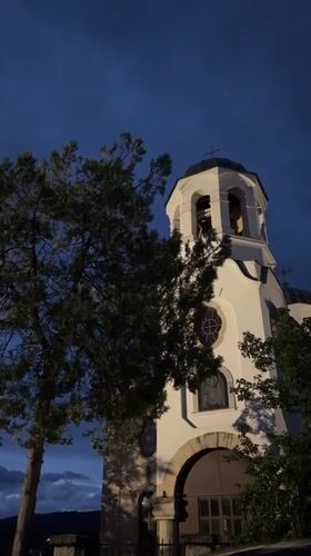 Orthodox church tower photographed at dusk in Strelcha, Bulgaria