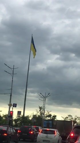 Street scenes documented in Kharkiv showing flag, cathedral, buildings