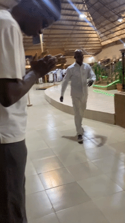 Religious ceremony in white robes held at Jos church