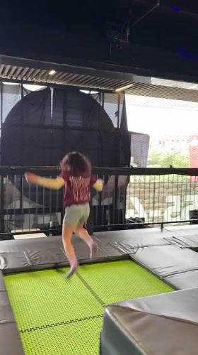 Young person performs backflip on indoor trampoline in Mexico City