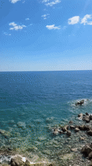 Two visitors enjoy coastal views in Perazića Do, Montenegro
