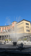 Street musician, fountain rainbows observed at Yerevan's Moscow Cinema