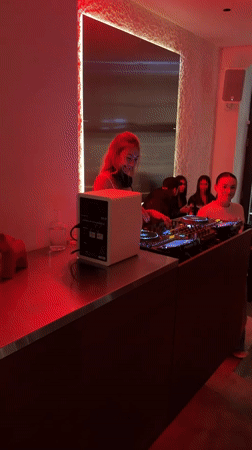DJ set under red lights at a Warsaw venue