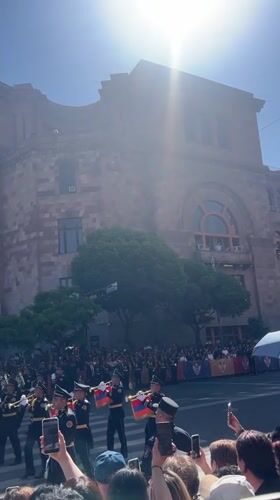 Marching band performs on Yerevan street with Armenian flags
