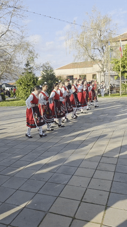 Young dancers perform Bulgarian folk dance in traditional costumes