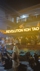 Crowd gathers at Revolution bar in Koh Tao, Thailand