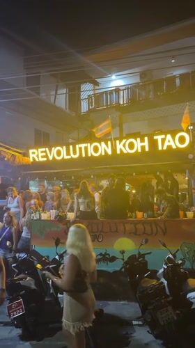 Crowd gathers at Revolution bar in Koh Tao, Thailand