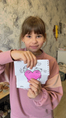 Child shares artwork, reads book during early morning hours