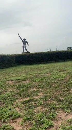 Torch-bearing statue documented in Ihiagwa park, Nigeria
