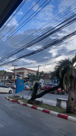 Motorcyclist refuels at PTT station in Baan Mae Nam