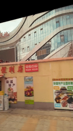 Modern curved landmark building in central Ürümqi, multiple angles