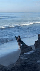 Morning surf session on North Kuta's black sand beaches